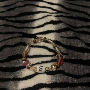 Elegant Beaded Bracelet with Pink and Gold Accents